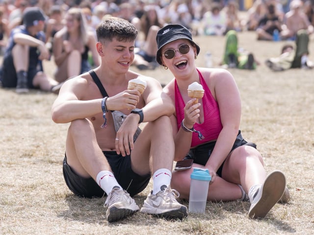 Two festivalgoers take a break for some ice cream.