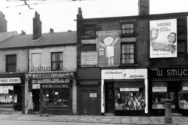 Shops on North Street in April 1955. Among them are; S and G General Stores; G.M. Lewis, Fitted Carpet Specialists and 'Shirtmakers Of Distinction'.