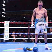 Josh Warrington walks out of the ring after laying down his gloves after defeat to Anthony Cacace in the IBO World Super Featherweight Title fight at Wembley Stadium (Picture: Richard Pelham/Getty Images)