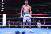 Josh Warrington walks out of the ring after laying down his gloves after defeat to Anthony Cacace in the IBO World Super Featherweight Title fight at Wembley Stadium (Picture: Richard Pelham/Getty Images)