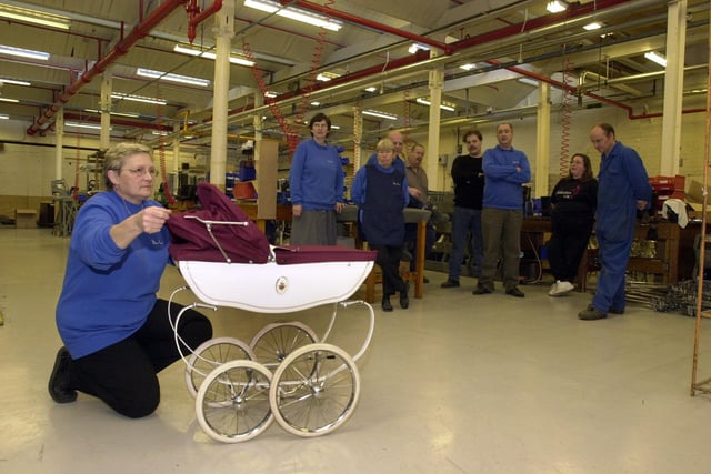 Christine Robinson of quality control with the last Silver Cross pram to be made at the factory in the town. Production finished on November 25, 2002.