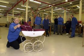 Christine Robinson of quality control with the last Silver Cross pram to be made at the factory in the town. Production finished on November 25, 2002.