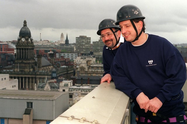 Leeds businessmen, Richard Bell, left, and Sean Hicks, look to the ground before their charity abseil down the Royal and Sun Alliance building in April 1998.