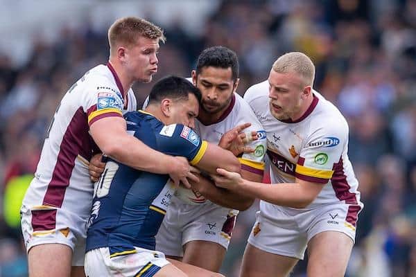 Leeds' Zane Tetevano is tackled by Harry Rushton, Sebastine Ikahihifo and Jack Ashworth. Picture by Allan McKenzie/SWpix.com.