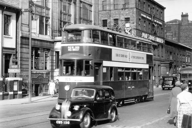 Tram No 525 on route 16 to New Inn, Wortley Business visible Wellington Street include James Hare Limited, woollen merchants and manufacturers at no 72 Wellington Street. Pictured in July 1956.