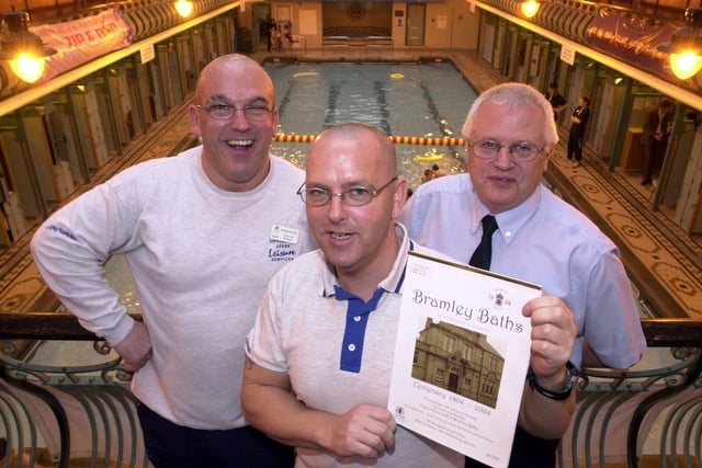 Chris Hanson with a copy of the Bramley Baths calender with Graham Mitchell, left and manager Brian Mills in December 2003.