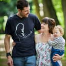 Stef Scurr (centre) with her husband Andrew (left) and baby boy, Harlan
