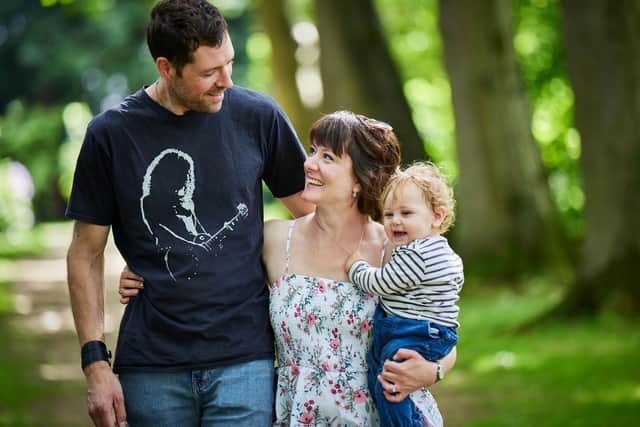 Stef Scurr (centre) with her husband Andrew (left) and baby boy, Harlan