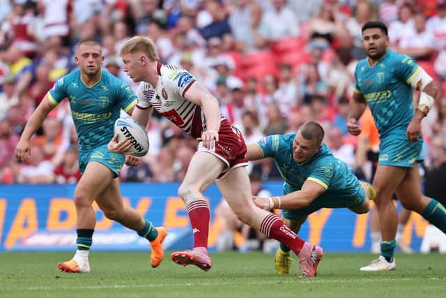 Jack Brown, of Hull KR, tackles Wigan's Zach Eckersley during last Saturday's Betfred Challenge Cup final. Picture by Alex Whitehead/SWpix.com.