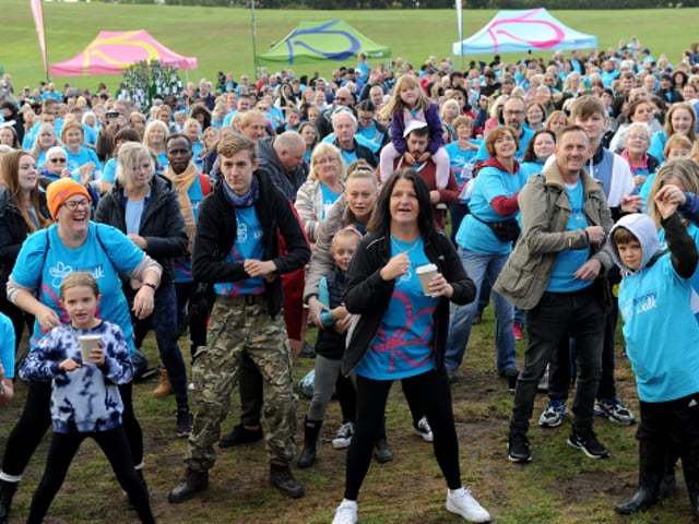 Participants limbering up for the Alzheimer's Society's Leeds Memory Walk at Temple Newsam.  (Picture: Steve Riding)