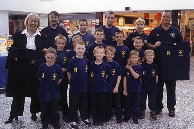 Kathy Murdoch, Cross Gates Shopping Centre manager, with the 14th Cross Gates Methodist Scout Group. Pictured in May 2002.