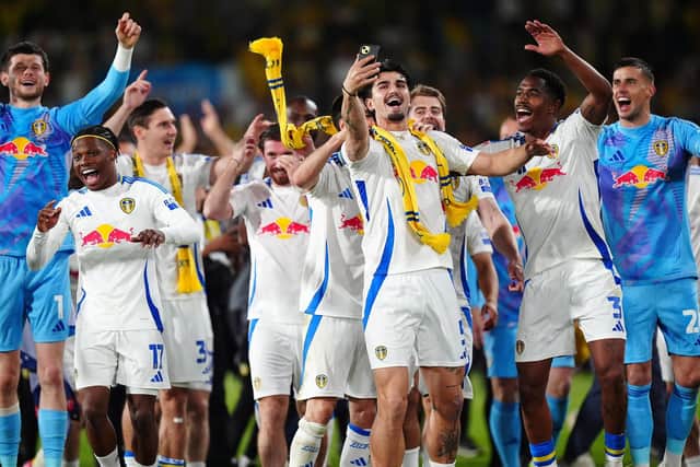 Leeds United players celebrate promotion to the Premier League. Photo: Mike Egerton/PA