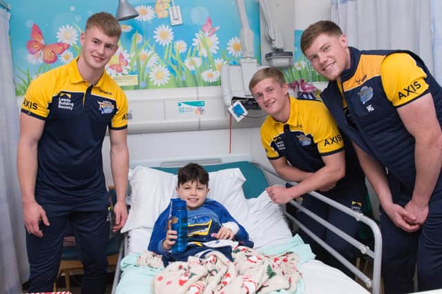 Rhinos players Max Simpson, Alfie Edgell and Morgan Gannon meet a young patient during their annual visit to Leeds Children's Hospital  Picture by Leeds Rhinos/Leeds Teaching Hospitals NHS Trust.