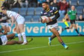 Kruise Leeming scores for Rhinos in their Boxing Day loss to Wakefield. Picture by Steve Riding.