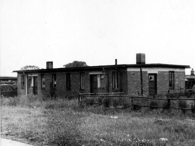 A MAP bungalow located on the Westfield estate in 1955. This is an example of the temporary homes which were erected in the Yeadon area to provide accommodation for people working at the AVRO Company. MAP (Ministry of Aircraft Production) brought in many workers to boost production. AVRO Lancasters and AVRO Ansons were two of the types of Aircraft which were built in Yeadon. This view of property prior to demolition.