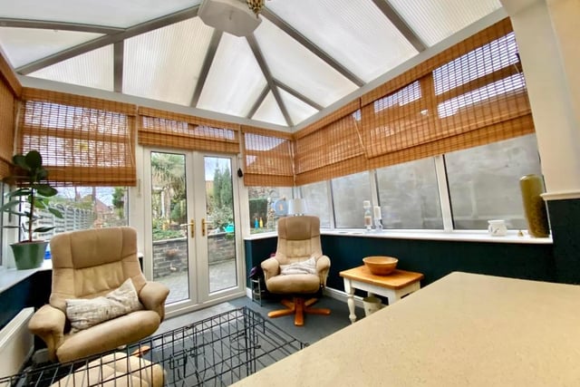 The conservatory is a fabulous space, says the brochure, with French style doors opening onto the garden.