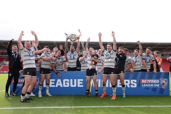 Dewsbury Rams celebrate with the 2023 Betfred League One trophy. Picture by John Clifton/SWpix.com.