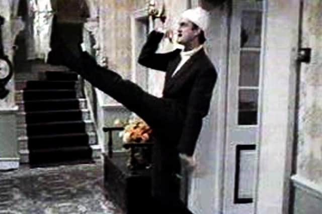 John Cleese's misanthropic hotel owner Basil Fawlty goose-stepping in Fawlty Towers (Photo: BBC)