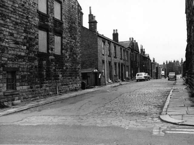 New Street in August 1968 in a view looking from Wesley Street. The original cobbled street has been tarmaced and repaired in places.