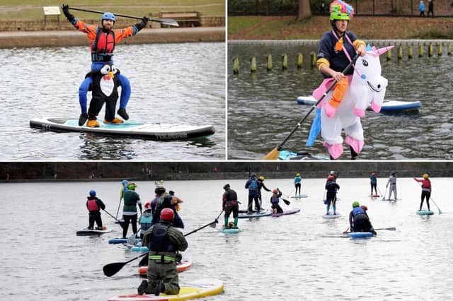 Paddle boarders descended on Roundhay Park's Waterloo Lake today to celebrate New Year's Day in fancy dress on the water.