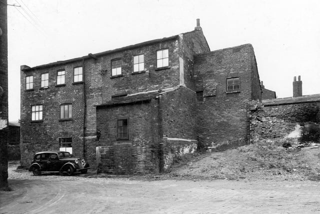 Worsted Street Mill, James Andrew Kavanagh, printer and lithographer was in business here. Situated off Mill Street, this is the back view. Pictured in August 1937.