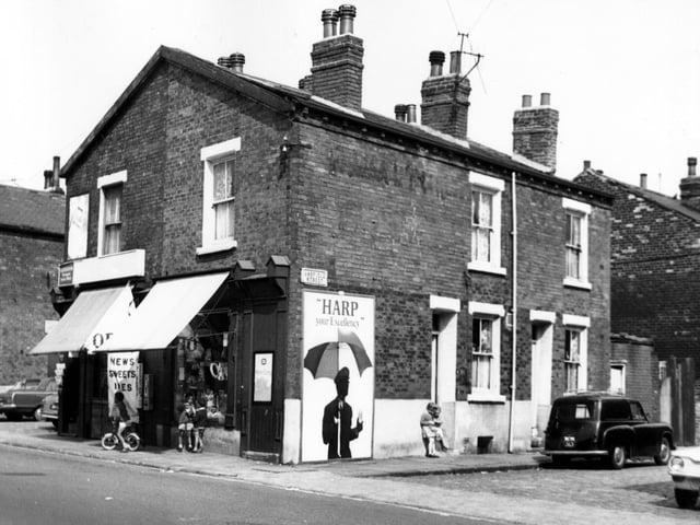 A newsagents on the corner of Cambridge Road and Oakfield Street in August 1967. To the right is Ashfield Street with two children outside a house.