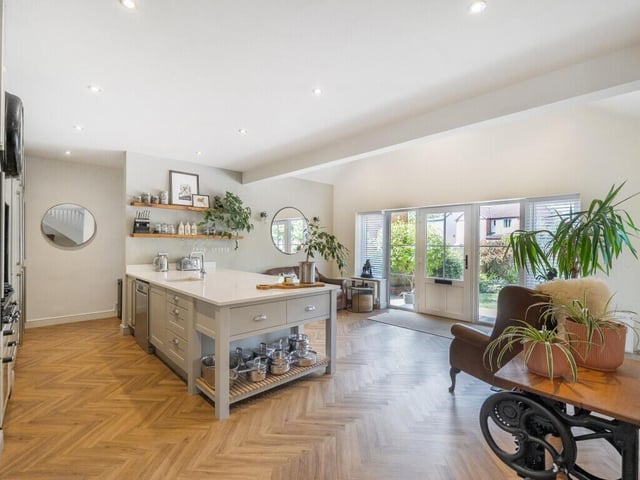 The kitchen is beautifully appointed with contemporary cabinetry, high-quality appliances, and generous worktop space, making it perfect for everyday family life and entertaining.