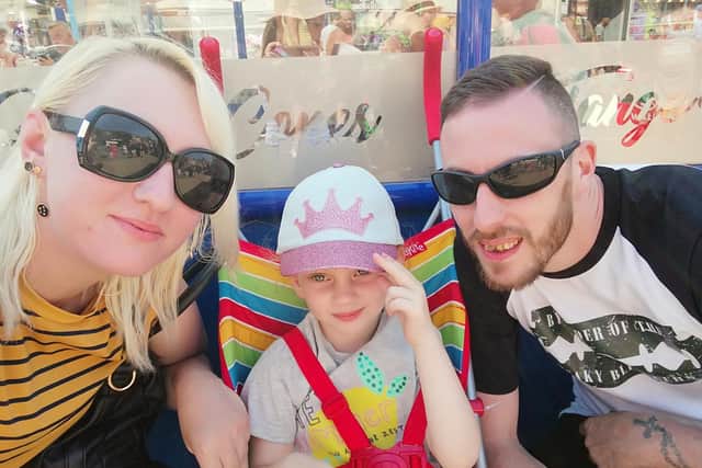 Jamie Harper and Leah Hayes enjoy a family day out with her daughter Evelyn. Picture: Leah Hayes / SWNS