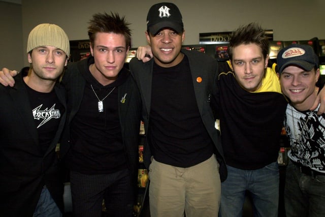 Pop group Phixx, from left, Chris Park, Nikk Mager, Pete Smith, Andrew Kinlochlan and Mikey Green during their visit to HMV in Leeds city centre on March 10, 2004.