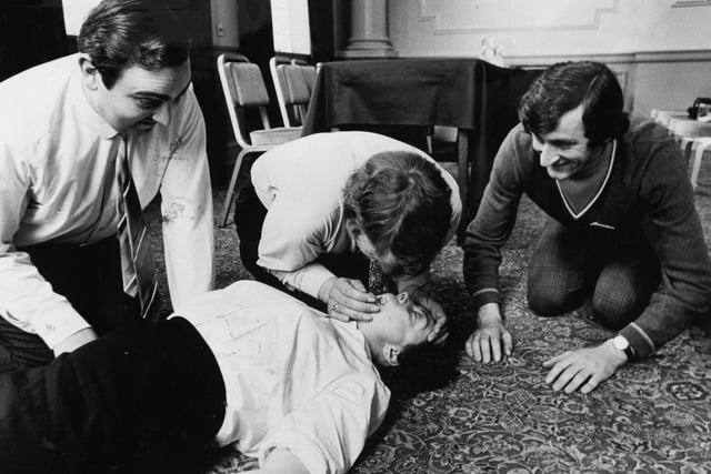 A three day course in first aid was held at the Metropole by the British Safety Council in conjunction with the West Yorkshire branch of the British Red Cross Society in May 1972. Pictured is David Turner preparing to give the kiss of life to Society member Evelyn Waddington. He was due to be followed by Peter Watson, left, and John Fitzpatrick.