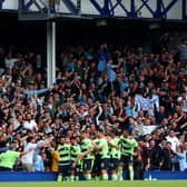 LIVERPOOL, ENGLAND - MAY 14: Ilkay Guendogan of Manchester City (obscured) celebrates after scoring the team's third goal during the Premier League match between Everton FC and Manchester City at Goodison Park on May 14, 2023 in Liverpool, England. (Photo by Clive Brunskill/Getty Images)
