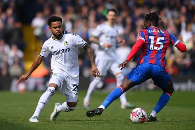 LEEDS, ENGLAND - APRIL 09: Jeffrey Schlupp of Crystal Palace runs with the ball whilst under pressure from Weston McKennie of Leeds United during the Premier League match between Leeds United and Crystal Palace at Elland Road on April 09, 2023 in Leeds, England. (Photo by Stu Forster/Getty Images)