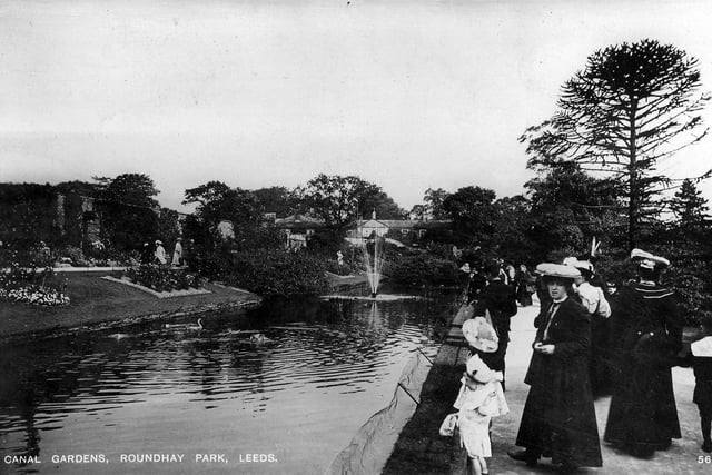 Canal Gardens at Roundhay Park from around the early 20th century. The Canal Gardens were laid out in the early 19th century by the Nicholson family who owned Roundhay Park at the time. They have proved a popular attraction for visitors, as seen here, since the park was taken over by the council in the 1870s.