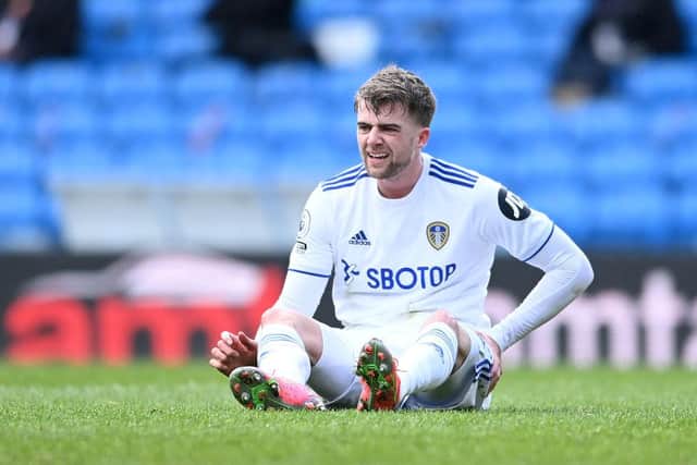 LEEDS, ENGLAND - MARCH 13: Patrick Bamford of Leeds United goes down injured during the Premier League match between Leeds United and Chelsea at Elland Road on March 13, 2021 in Leeds, England. Sporting stadiums around the UK remain under strict restrictions due to the Coronavirus Pandemic as Government social distancing laws prohibit fans inside venues resulting in games being played behind closed doors. (Photo by Laurence Griffiths/Getty Images)