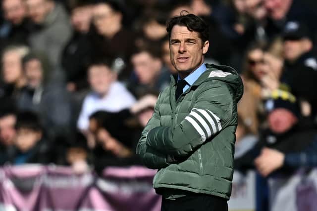 Burnley's English manager Scott Parker watches the players from the touchline during the English FA Cup fifth round football match between Preston North End and Burnley at Deepdale stadium in Preston, north-west England on March 1, 2025. (Photo by Paul ELLIS / AFP)