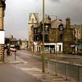 Pudsey Town Centre with Pudsey Town Hall in the background. On the right is Market Place, now the site of the new bus station. Running through the centre of the image is Church Lane.