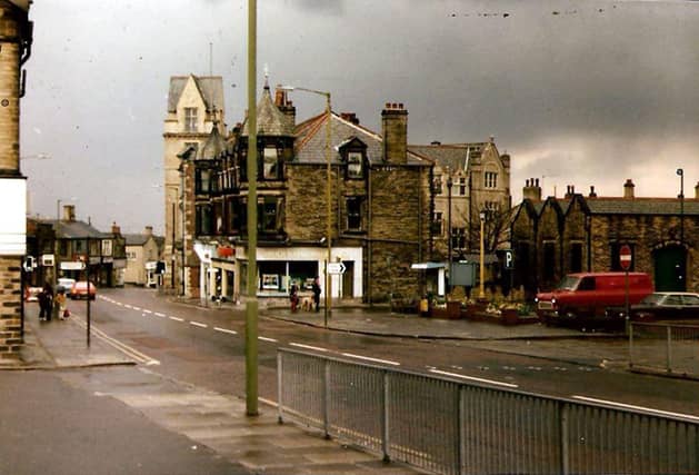 Pudsey Town Centre with Pudsey Town Hall in the background. On the right is Market Place, now the site of the new bus station. Running through the centre of the image is Church Lane.