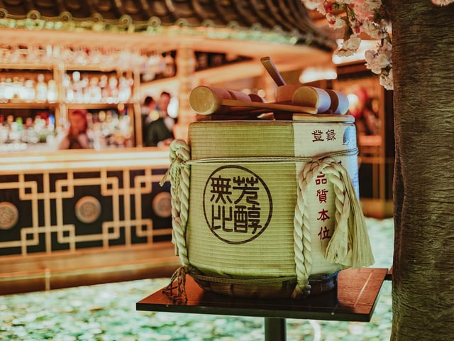 Drinks served included a selection of refreshing cocktails alongside The Ivy Collection Champagne and a sake barrel, pictured.
