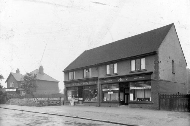 Shops on the south side of Dib Lane pictured in July 1936. Elaine, ladies hairdresser, Atkinson, greengrocer, Ward and Son confectioners with goods in the window.