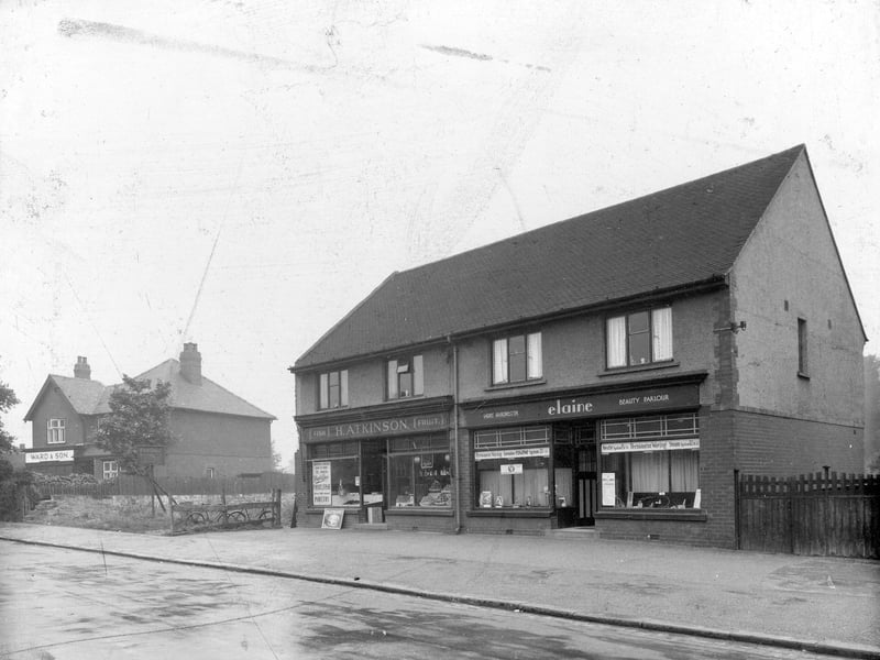 Shops on the south side of Dib Lane pictured in July 1936. Elaine, ladies hairdresser, Atkinson, greengrocer, Ward and Son confectioners with goods in the window.