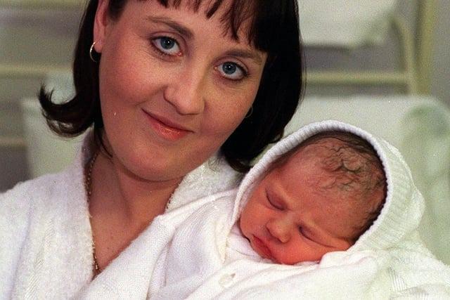 Elizabeth Butterill from Bramley with baby Chloe who was born at 2.05am on Christmas Day in 1998, weighing 7lb 12oz.