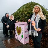 Parents David and Karen Wilson, with their daughter Laura Wilson, next to their pink memorial box near Moortown Social Club in Cranmer Gardens.. The memorial box honours Victoria 'Tori' Wilson, who died in a tragic car crash in Thorner in 2020. Photo: James Hardisty
