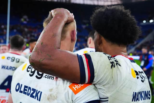Mikolaj Oledzki is consoled by Leeds Rhinos teammate Kallum Watkins following England's defeat to Australia in the second Ashes Test at Everton FC's Hill Dickinson Stadium, Liverpoo. Picture by Olly Hassell/SWpix.com.