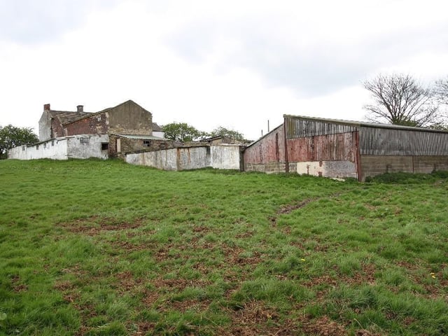 The farmhouse sits on six acres of land.