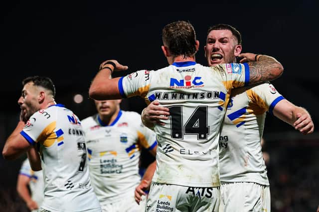 Cameron Smith congratulates Chris Hankinson after his crucial try in Leeds Rhinos' win at Wakefield Trinity. Picture by Alex Whitehead/SWpix.com.