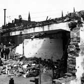 The demolition of air raid shelters on City Square in August 1946. Onlookers observe the situation. Standard Buildings with Barclays Bank local head office, Standard Life Assurance and British General Insurance are visible in the background.