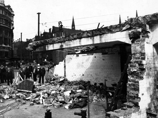 The demolition of air raid shelters on City Square in August 1946. Onlookers observe the situation. Standard Buildings with Barclays Bank local head office, Standard Life Assurance and British General Insurance are visible in the background.