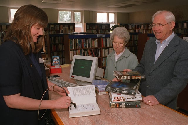 New Computer Systems were installed at Garforth Library in June 1996. Pictured is chief librarian Jan Cryer with library users Mr and Mrs Smith.