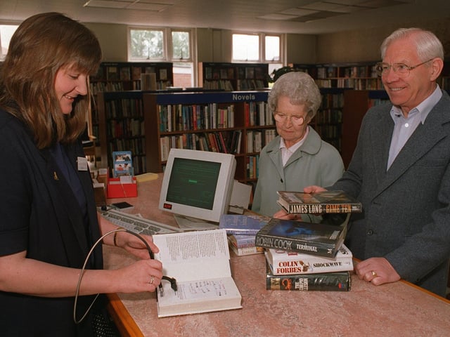 New Computer Systems were installed at Garforth Library in June 1996. Pictured is chief librarian Jan Cryer with library users Mr and Mrs Smith.
