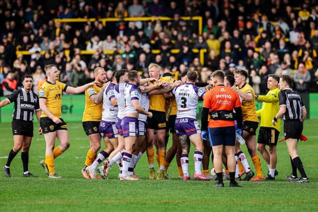 Players clash during Castleford Tigers' Easter loss to Wakefield Trinity. Picture by Alex Whitehead/SWpix.com.